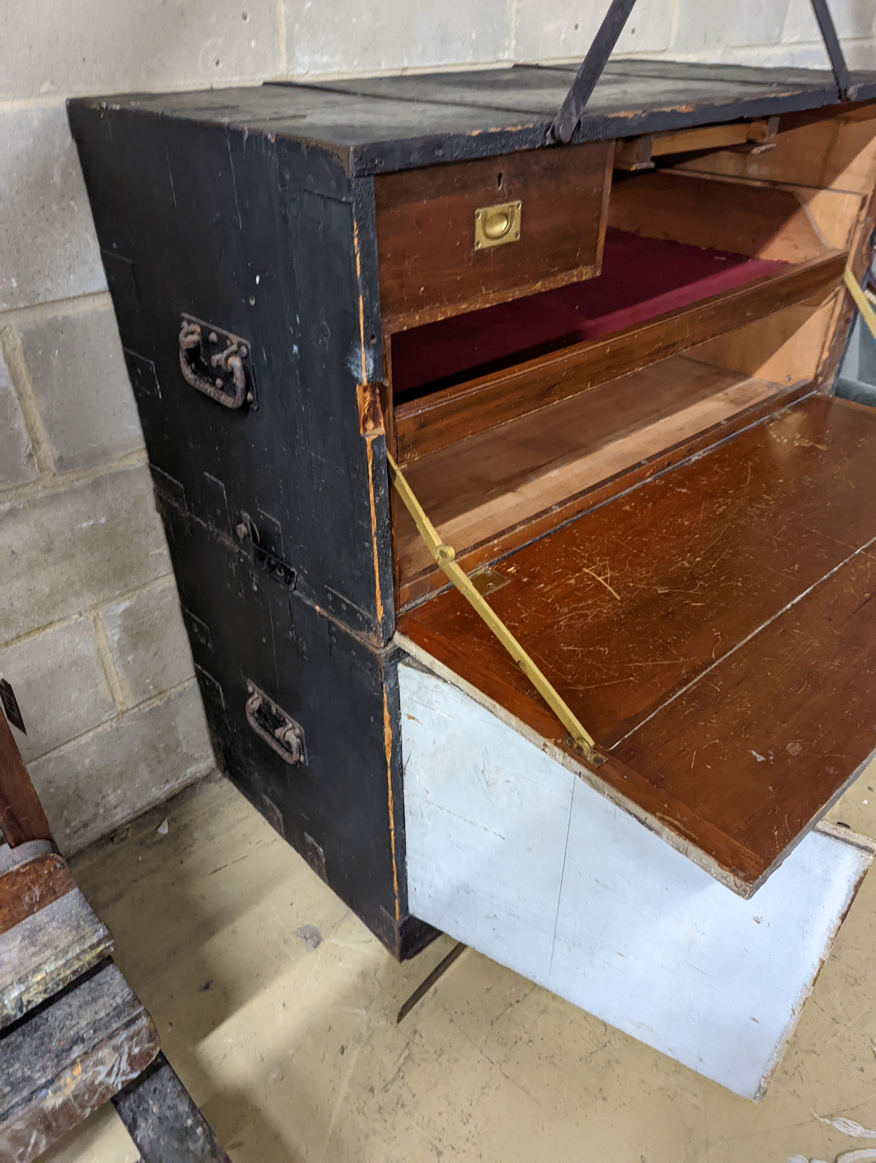 An early 20th century painted and stained pine campaign chest - owners name plate for W.E Higham, R.N. , retailers name plate Gieve’s. W-106cm, D-54cm, H-114cm.